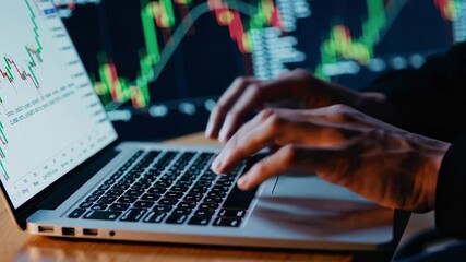 Aufkleber - Financial analyst working on laptop with candlestick charts displayed on multiple screens in background, analyzing market trends and making investment decisions in slow motion