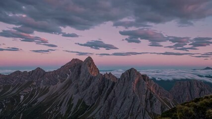 Poster - Beautiful mountain landscape at dusk with colorful clouds and serene valleys