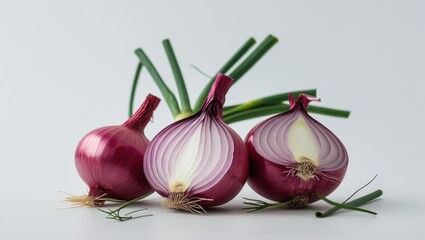 Poster - Fresh red onions with green tops arranged on a white background with Copy Space for text placement