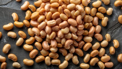 Aufkleber - Raw brown beans scattered on a dark textured surface showcasing their natural color and shape with ample copy space.