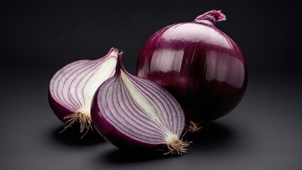 Poster - Red onion with two halves showcasing inner layers on dark background with copy space