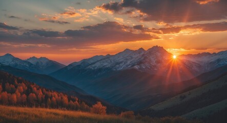 Poster - Mountain landscape during sunset with dramatic sky, sun rays illuminating peaks and autumn foliage in the foreground, Copy Space.