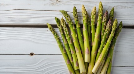 Aufkleber - Fresh green asparagus spears arranged on white wooden background with natural light and copy space for text