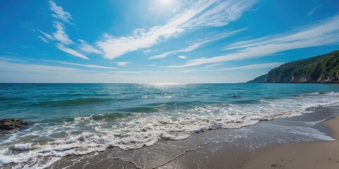 Aufkleber - Stunning seascape with gentle waves on sandy beach under clear blue sky and sun reflection on water Copy Space