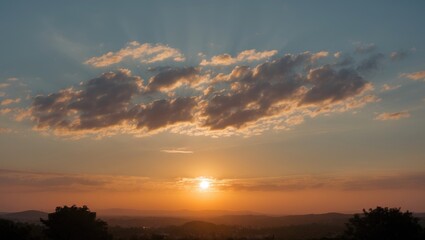 Aufkleber - Scenic sunset over rolling hills with layered clouds and warm light during golden hour with copy space for text