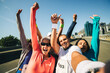 © Jacob Lund - Group of runners celebrating their race success together outdoors with a selfie