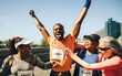 © Jacob Lund - Joyful marathon runner celebrates victory with supportive friends