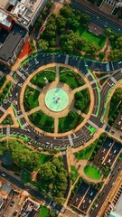 Wall Mural - Transport moves by the roundabout surrounded by lush greenery. Top view. Lively roads of Philadelphia. Vertical video