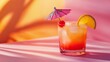 © VK Studio - A refreshing tropical cocktail sits under vibrant sunlight, complete with a cherry and a decorative umbrella, evoking summer bliss.