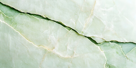 Poster - The surface of the stone is an uneven light green color with cracks.