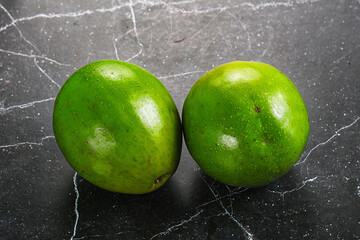 Wall Mural - Two ripe green exotic avocado fruit