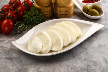 Wall Mural - Organic mozzarella cheese slices in the plate