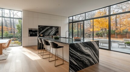 Poster - Modern kitchen with black and white marble island, autumnal backyard view