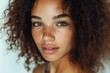 © vasyan_23 - Young african female with curly hair and natural freckles