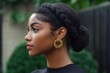© vasyan_23 - Side profile of young african female with braided hairstyle and gold jewelry