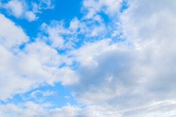 Wall Mural - blue sky with clouds, picturesque blue sky background with scenic fluffy clouds