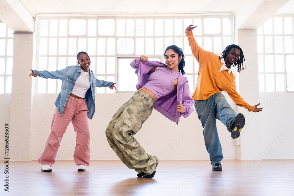 Multiethnic group of young hip hop dancers wearing colorful streetwear ...