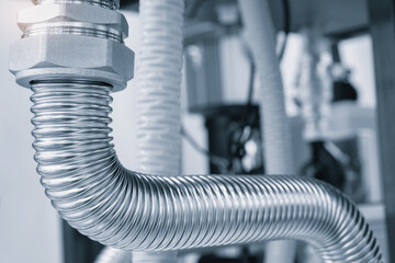 Poster - close up of a group of metal pipes as industrial background. pipes are silver and have a shiny appearance. Concept of industrial Chemical pharmaceutical device