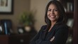 © Aysel - Happy cheerful 45 year old Latin professional mid aged business woman corporate leader, smiling positive mature female executive manager standing in office arms crossed looking at camera, portrait.