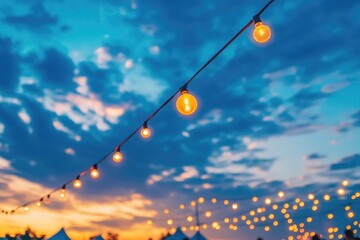 Poster - A collection of string lights suspended from a bright blue sky, perfect for decorating or photography projects