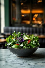 Wall Mural - Fresh salad bowl on marble table. Blurred restaurant background, healthy eating