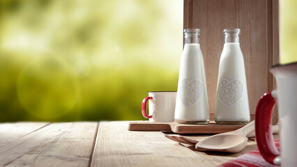 Wall Mural - fresh milk in glass on wooden table with outdoor spring background.