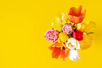 Wall Mural - festive background with a beautiful bouquet of tulips flowers. yellow, red, white tulips bouquet on 