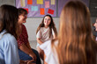 © Gigi Delgado - Teenage girls are participating in a support group meeting at school, sharing their experiences and providing mutual support. Image with copy space.