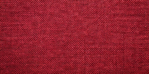 Poster - Close-up view of a deep burgundy fabric reveals intricate textures and weaves, highlighting the craftsmanship involved in its production during daylight hours