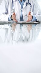 Wall Mural - Unknown doctor woman, wearing a stethoscope, blue blouse under a lab coat, is gesturing with hands overs a glass desk with a laptop in clinic office, close up vertical view. Medicine and science