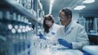 © Niphaphan - Advanced scientific lab, two researchers analyzing chemicals in a flask, discussing findings, medical research, biotechnology, molecular biology