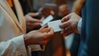 © renny - Close-up image of hands exchanging blank business cards