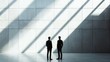 © Chayanin Wongpracha - two businessmen standing in modern office space