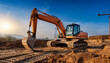 © Gabriela - Orange Excavator at Sunset