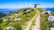 © L.H - Mountaintop path with windmill, scenic vista