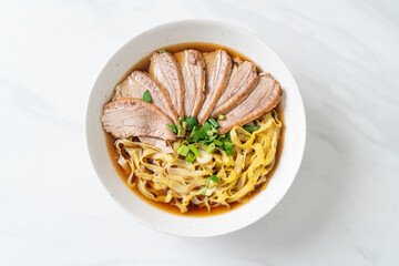 Wall Mural - egg noodles with stewed duck in brown soup