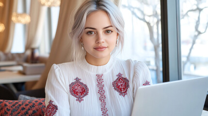 Wall Mural - Purple hair Business woman in white dress with embroidery working with a laptop