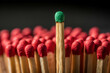 © Butsarakham - Green Match Standing Out From Red Matches In A Conceptual Close Up Display With