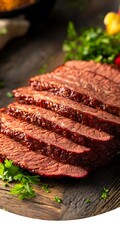 Wall Mural - Sliced beef on wood. Herbs in foreground. Meal prep concept