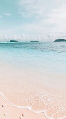 Wall Mural - Waves washing onto shore, island hills afar, under blue sky. Promo shot for vacation rentals