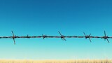 Barbed wire fence stretching under a clear blue sky, sharp metal wires and edges visible, emphasizing security and protection, highrealism outdoor scene