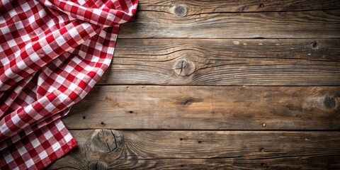 Poster - Rustic Wooden Surface with a Red and White Checkered Cloth Draped Elegantly