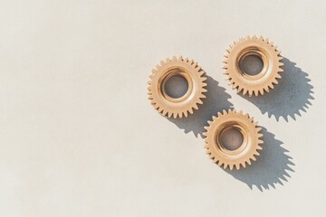 Fototapete - Minimalist Industrial Aesthetics Trio of Brass Gears on Concrete Surface - Operational Excellence in Manufacturing and Systems Integration for Modern Industry Efficiency