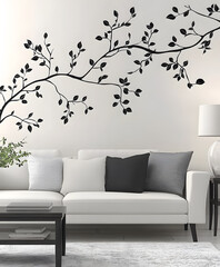 Poster - A modern living room featuring a stylish white sofa, decorative cushions, and a black leaf wall decal, creating a serene and elegant atmosphere