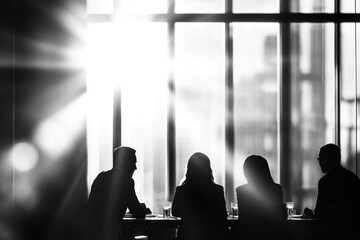 Sticker - A group of people sit together at a table with a window view, suitable for meetings, gatherings or social events