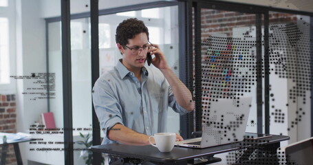 Aufkleber - Image of financial data processing over caucasian businessman using laptop in office