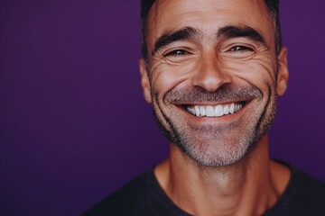 Wall Mural - A smiling man in front of a bright purple background