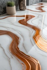 Poster - A close-up view of a marble table with a green plant growing in the background