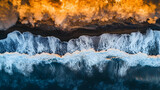 Aerial view ocean waves meet volcanic lava at sunset