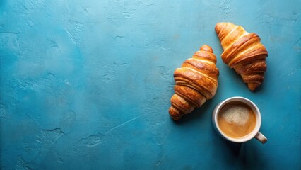 Canvas Print - Aromatic Coffee and Flaky Croissants on a Textured Blue Surface